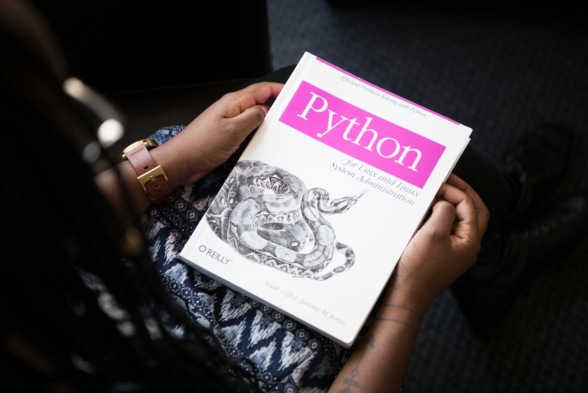 shallow focPython development setup showing various project components - Learn to build professional-grade Python applicationsus photo of Python book